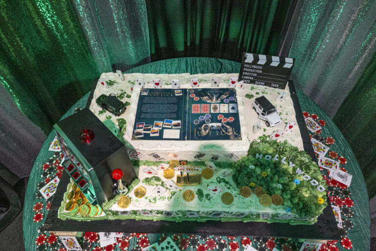 Book release party: Book-themed cake decorated with poker chips and playing cards