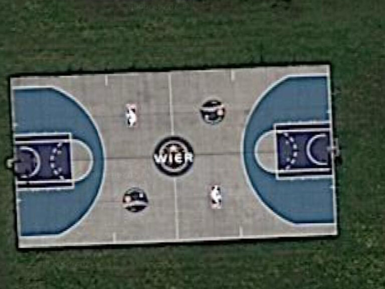 Aerial view of a basketball court with the Wier logo at center court