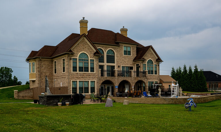 Large stone house with balconies in summer