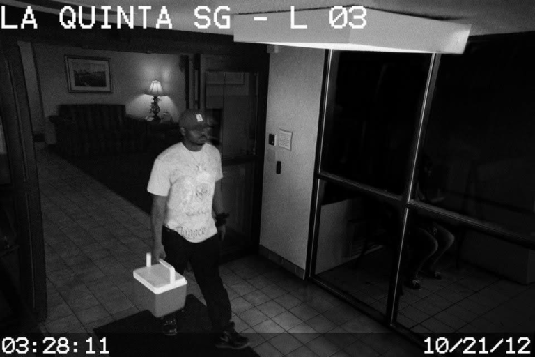 Security camera still of a man in a hotel lobby