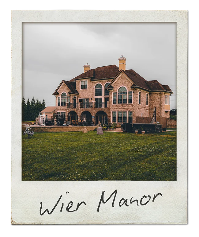 Polaroid captioned "Wier Manor": a large brick house
