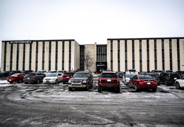 Office complex with a full parking lot in winter